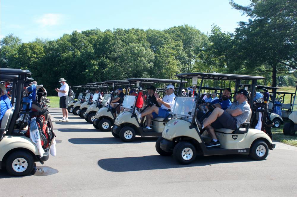 all attending Lakers lined up in golf carts